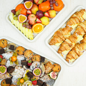 Breakfast - morning catering options including pastries, fruit, yoghurt and hot baps